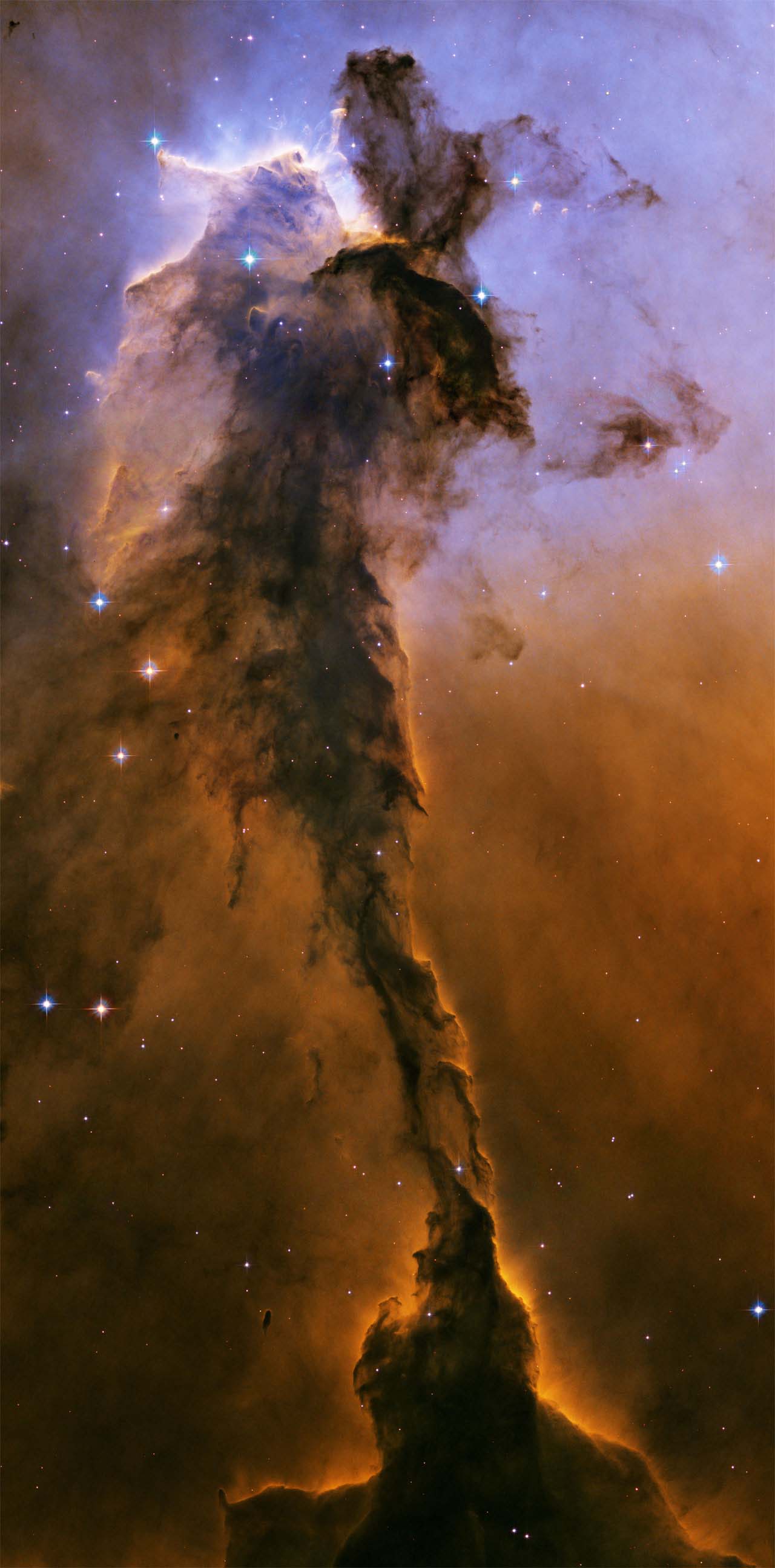 Feliz Navidad desde la Nébula del Águila. Haga click en la imagen para agrandar. Crédito: NASA, ESA, STScI/AURA.